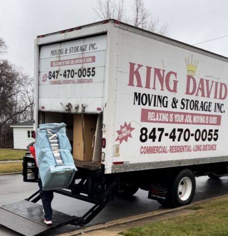 Professional Wheeling movers loading furniture during a residential move in Wheeling IL